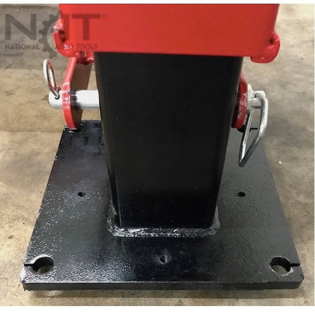 A close-up view of a black metal base plate and the bottom of one of the red lift posts for the NOS9000XLT, with two silver bolts and a "NAT" logo visible.