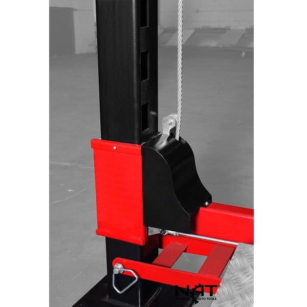 A close-up view of a locking mechanism on the NOS9000XLT lift, showing a silver cable and a red latch on a black post. The "NAT" logo is visible at the bottom.