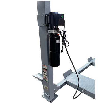 A close-up of the black hydraulic motor unit on a gray post of the Triumph NSS-11 four-post lift.