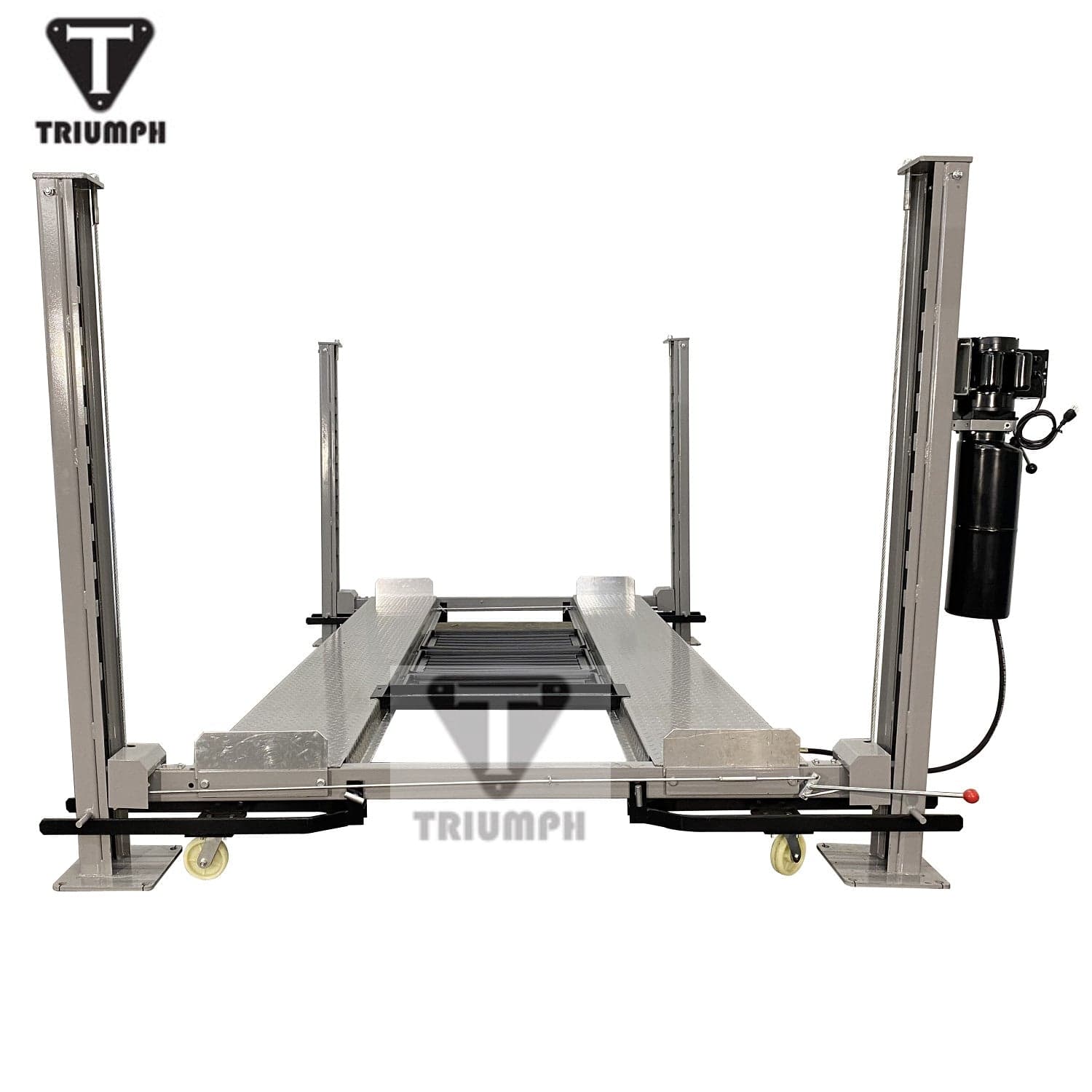 A front view of the light grey Triumph NSS-8 Four-Post Lift, showing the runways with three black drip trays placed in the center. A jack tray is positioned at the back of the runways.