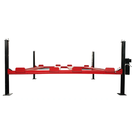 A close-up view of the caster wheels on the red frame of the NSS9000 lift, showing the wheels and the pin used to secure them to the lift post.