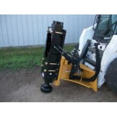 A close-up view of the yellow skid-steer post driver attachment from Haugen Attachments mounted on a skid steer, highlighting its robust construction.