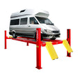 A red AMGO PRO-14E 4-Post Lift with yellow ramps, elevating a large silver passenger van on its long runways against a white background.