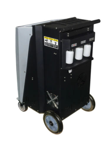 A side view of the Katool R-1234YF Recovery & Recharge Machine, showing its black and gray casing with three clear oil bottles on the right side and a handle for mobility.