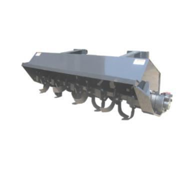 A gray skid-steer rotary tiller with an offset design and protective skid shoe, designed to cover wheel tracks and till forward or backward.