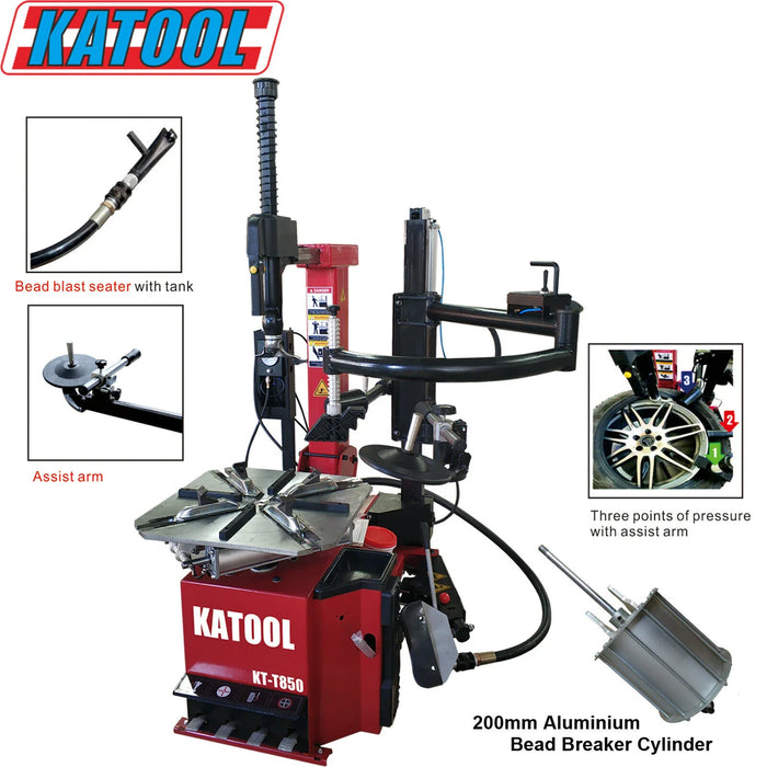 A detailed view of the Katool KT-T850 Tire Changer, showcasing its key features with overlay text pointing to the "Bead blast seater with latex," "Assist arm," and "200mm Aluminium Bead Breaker Cylinder."