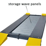 A close-up view of the black metal platforms of a four-post lift, with "storage wave panels" labeled in overlay text to highlight the corrugated surface texture of the platforms. The platforms also have yellow drive-on ramps.
