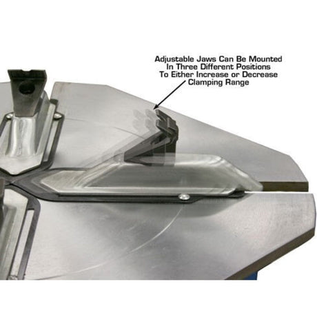 A close-up of the clamping jaws on the Atlas® TC755 tire changer, with overlay text explaining that the adjustable jaws can be mounted in three different positions to increase or decrease the clamping range.