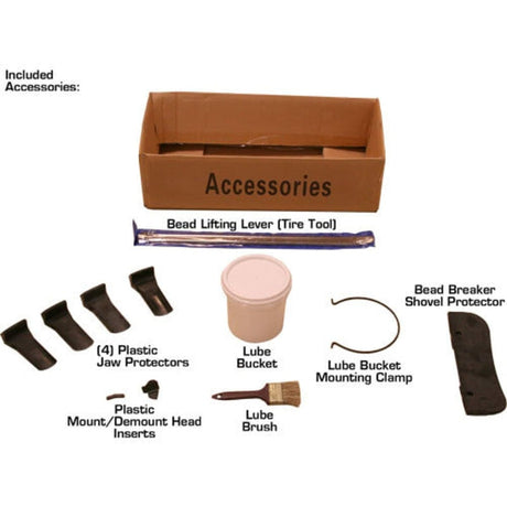 The included accessories for the Atlas TC289DAA tire changer, laid out on a white background, including the bead lifting tool, lube bucket and brush, and plastic jaw protectors.