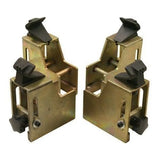 A pair of golden motorcycle clamp adapters for the Atlas® TC289 tire changer, shown with their black protective plastic covers.