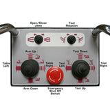 A close-up of the Atlas TTC606 wired remote control panel, showing various labeled buttons for functions like 'Open/Close Jaws,' 'Tool Rotation,' and a red 'Emergency Shut Off Switch.'