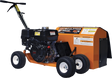 Three-quarter view of the Brave 9-in. Steerable Trencher/Bed Sculptor, showing its compact, steerable design with the engine and all four wheels visible. The product features several warning decals.