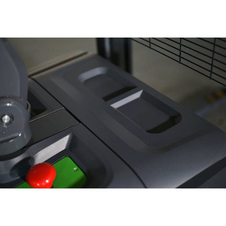 A close-up of the red emergency stop button and controls of the EKKO EB18C-118Li Electric Straddle Stacker.