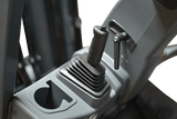 A close-up view of the joystick control on the EKKO EK18GS forklift's control panel, showing the rubber boot and a small cup holder to its side.