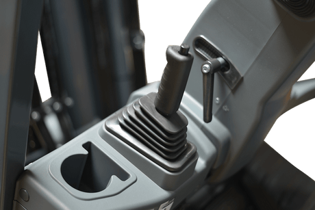 A detailed view of the side-shifting forks and controls of the EKKO EK25G-LI, showcasing the precise load control feature.