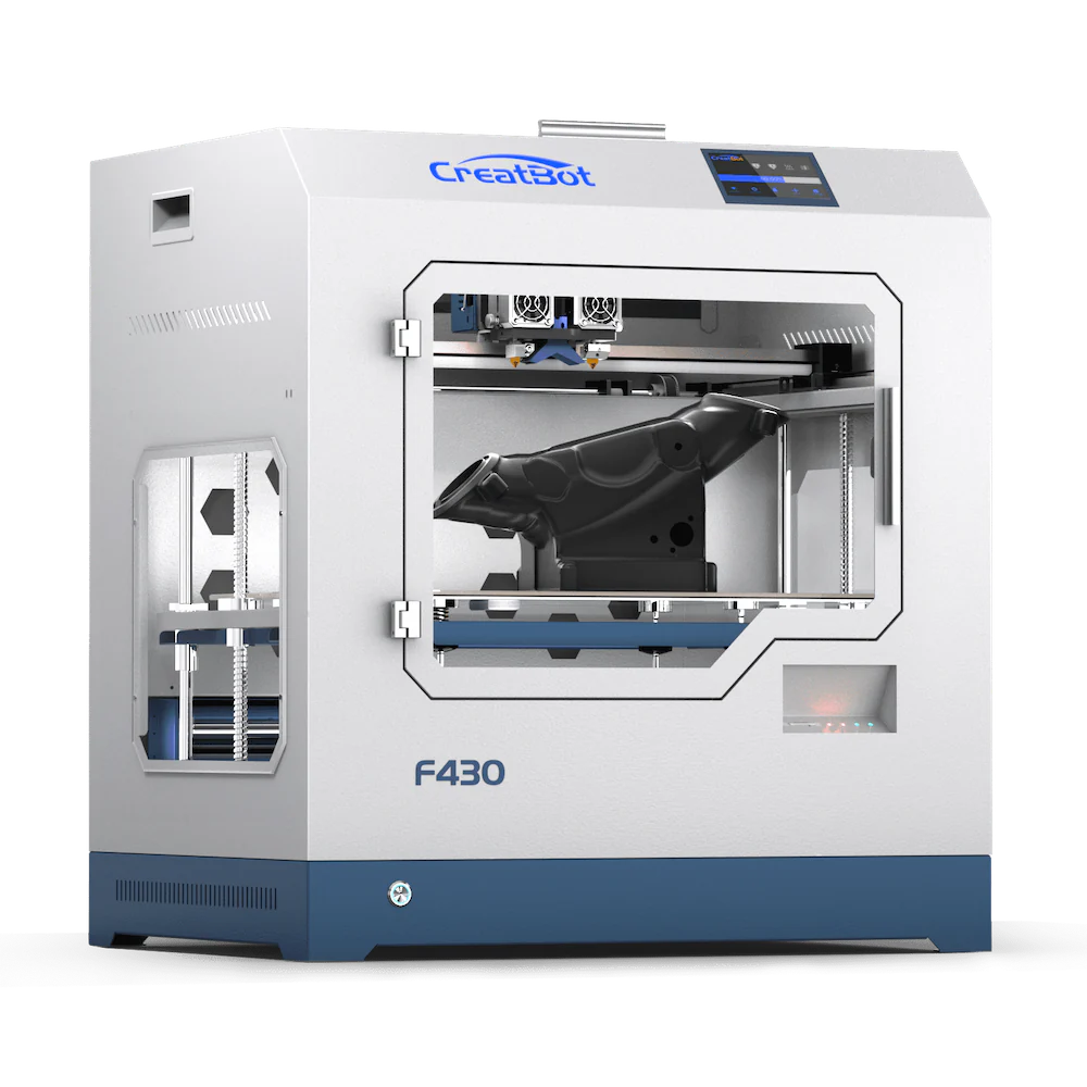 A front view of the CreatBot F430 3D printer, showing its fully enclosed chamber, dual extruders, and a large black object printed on the build platform.