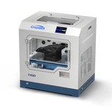 A three-quarter view of the CreatBot F430 3D printer, with the front door closed, showcasing the dual-extruder system and the printed object inside the enclosed printing chamber.
