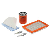 The Generac Guardian maintenance kit is displayed on a white background, showing the included parts: a cylindrical orange and black oil filter, an orange-rimmed rectangular air filter, two spark plugs, and a blue filter chamois.