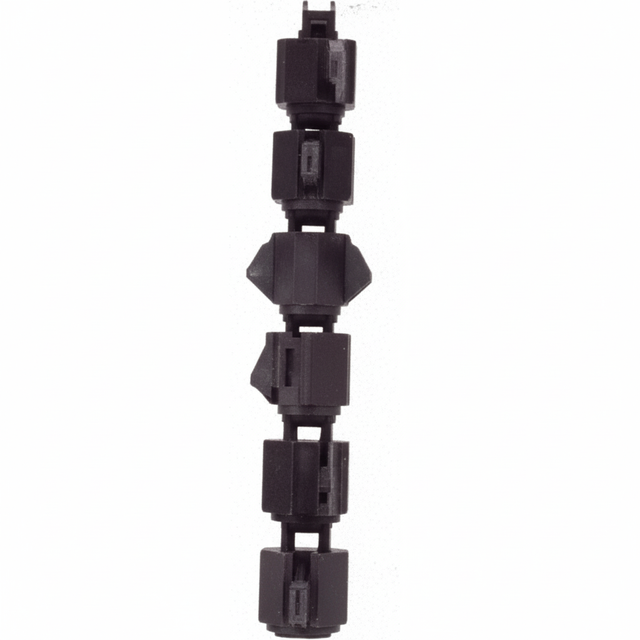 A black and gray Terminator Trencher chain with multiple tungsten carbide teeth, positioned vertically in a studio shot against a black background.