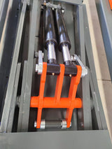 A close-up shot of the dual hydraulic cylinders on the Katool KT-310 frame machine, highlighting the robust construction of the lifting mechanism.