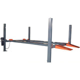 A full view of the Katool KT-4H110 4-post car lift on a white background, featuring a gray frame, black hydraulic power unit, and bright orange approach ramps
