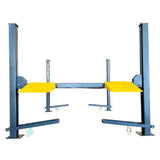 A close-up of the textured, black and yellow plate approach ramp on the car lift