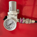 A detailed view of the pressure regulator and gauge on the Katool KT-B795L Heavy Duty Truck Wheel Balancer computer wheel balancer, an essential component for controlling the compressed air supply to the machine.