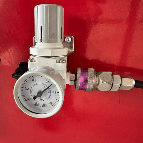 A detailed view of the pressure regulator and gauge on the Katool KT-B795L Heavy Duty Truck Wheel Balancer computer wheel balancer, an essential component for controlling the compressed air supply to the machine.