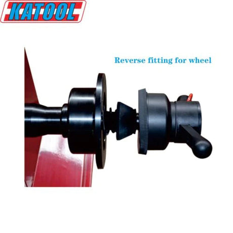 A focused close-up of the Katool KT-B700 Wheel Balancer's shaft, highlighting the "Reverse fitting for wheel" feature. The image shows the black mounting hub and quick-release mechanism attached to the red machine base, with the brand name "KATOOL" visible at the top.