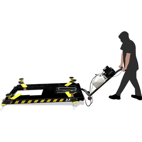 A silhouette of a man moving a black and yellow AMGO MR06 Mid-Rise Portable Scissor Lift with a power unit stand.