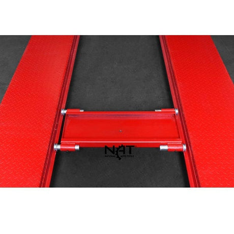 A top-down view of the red jack tray for the NOS9000XLT lift, positioned between the two red runways with a "NAT" logo on the side.