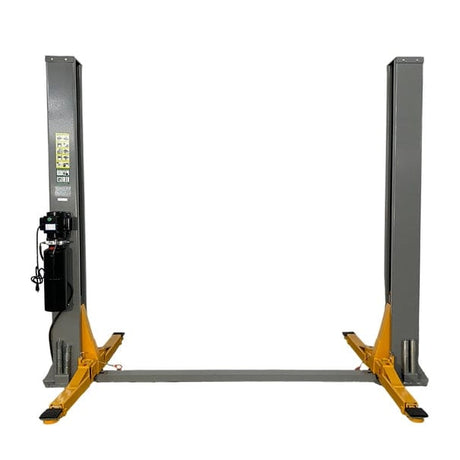  A front view of the Triumph NT-9 Two-Post Auto Lift in a grey color, with its lift arms in the lowered position. The power unit is visible on the right post, and a black hose runs between the two posts along the floor.