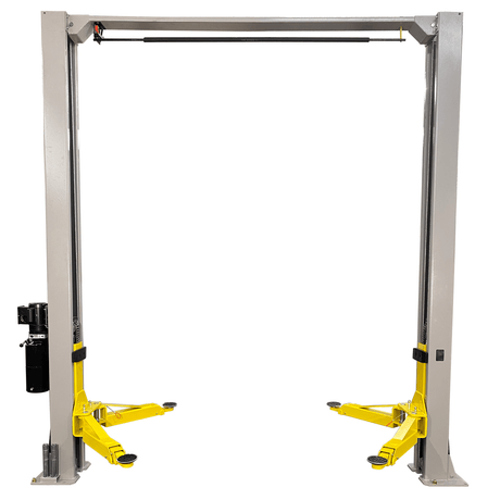 The front view of a gray and yellow Triumph NTO-9AE two-post auto lift with an overhead beam.
