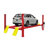 A white hatchback is elevated on a red AMGO PRO-12 4-Post Lift, with the yellow drive-on ramps lowered to the ground on a solid white background.