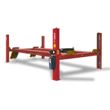 A red AMGO PRO-30E Heavy-Duty 4-Post Lift with its platforms elevated, viewed from an angle that highlights its sturdy construction, single-post hydraulic pump, and extended length.