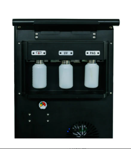 A three-quarter front view of the Katool R-1234YF Recovery & Recharge Machine, showcasing its dual-toned white and gray body, large wheels, and the front panel with its screen and gauges.