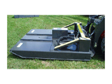 A black industrial-grade brush cutter with a 1/4" reinforced deck and two blades, designed to mow fields and cut 3" trees, shown attached to a skid-steer loader in a grassy field.